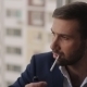 Man Lights a Cigarette At The Window - VideoHive Item for Sale
