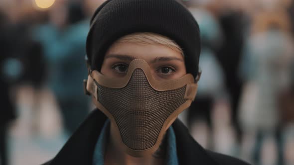 Portrait of Young Woman with Face Mask in the Crowd