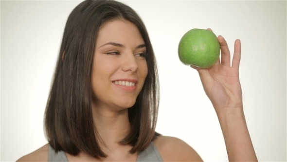 Attractive Athletic Girl With Green Apple