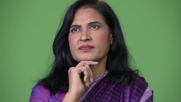 Close Up Shot of Mature Beautiful Indian Woman Thinking While Wearing Sari Traditional Clothes