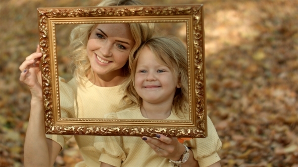 Mother And Daughters Taking Picture