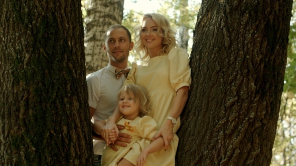 Happy Family In Golden Maple Autumn Park