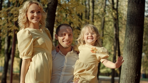 Happy Family Make a Photo In Autumn Park 