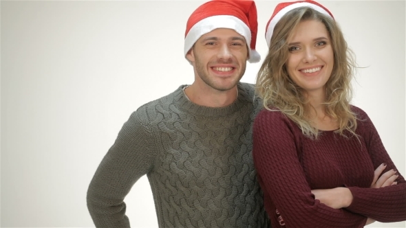 Cheerful Couple In Santa Hat Laughs