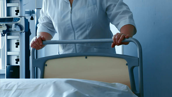 Nurse Prepares Delivery Room before Child Birth