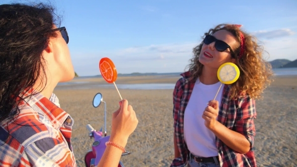 Trendy Summer Girls With Lollipop On Beach 