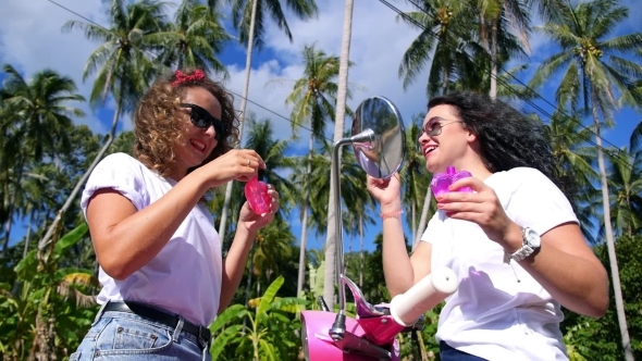 Two Beautiful Happy Girls In Sunglasses Outdoors