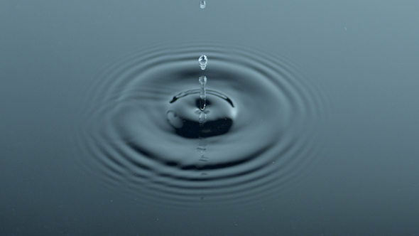 Drop Of Water Rippling The Surface