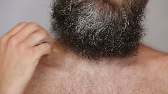 White Man Taking Care Of His Lush Beard