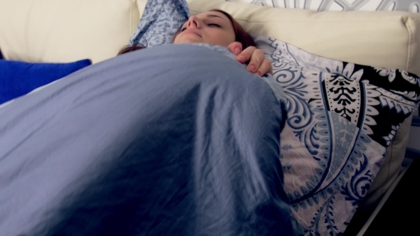 Woman Sleeping In Bed Tossing And Turning