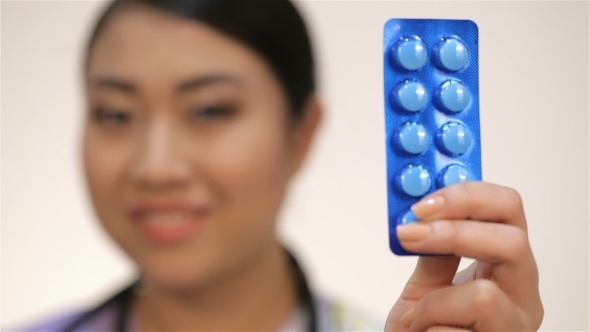 Woman Nurse With Pills Plate alt