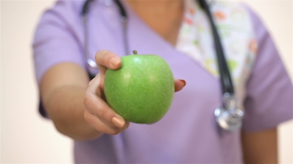 Doctor Showing Pharmaceutical And An Apple alt