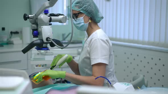 Side View Concentrated Dental Assistant Using Curing Light for Polymerization of Filling Material