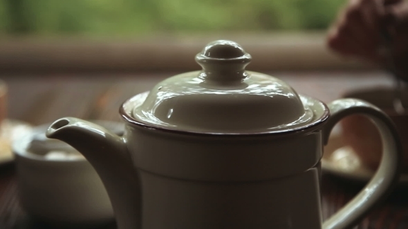 White Porcelain Teapot On Wooden Table