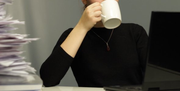 A Secretary Having Coffee