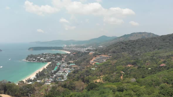 Panoramic view of Phuket coastline. Tropical beach and dense rainforest 