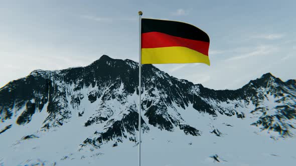 Germany flag above the snowy mountains. 4K Aerial View