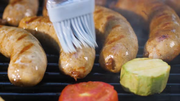 Lubricate Grilled Sausages with Oil with a Brush While Frying