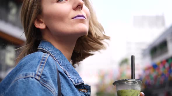 Portrait Of Young Fashionable Woman Outdoors On Street In City