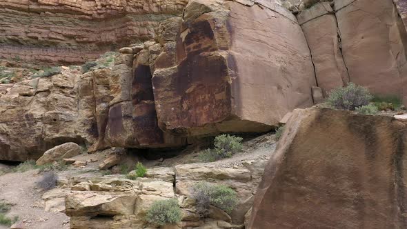 Rotating aerial view of petroglyphs on rock in Utah