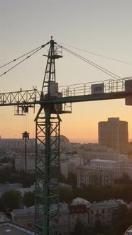 Construction Crane in the City at Sunrise