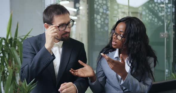 Professional Mixed Race Businesspeople Talking on Camera During Online Conference