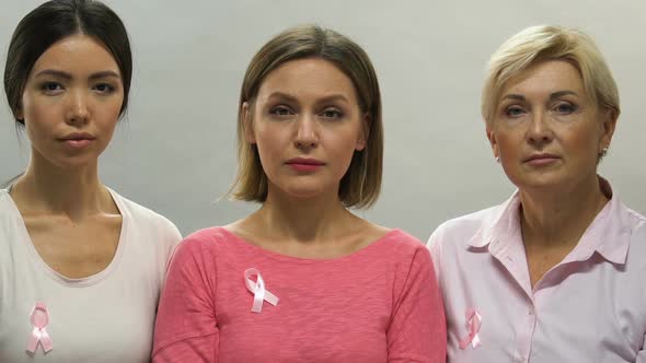 Portrait of Sad Women With Pink Ribbons, Breast Cancer Prevention, Bad Statistic