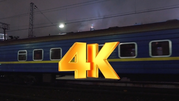 Passenger Train Arriving To Station In The Evening alt