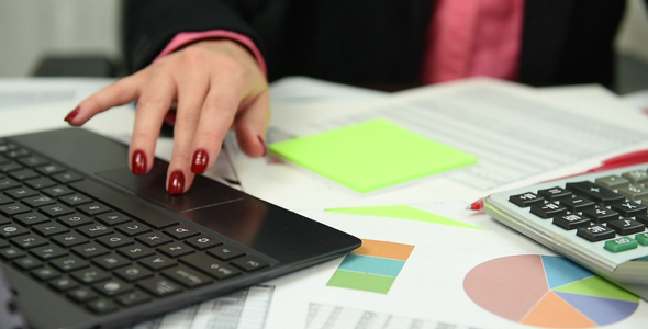 Businesswoman Analyzing Market Data 