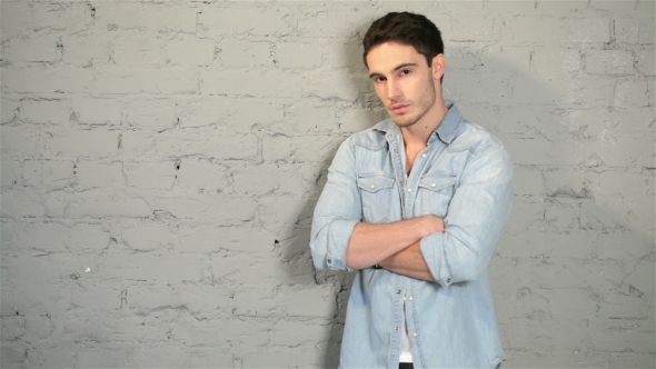 Male Posing In a Denim And a White T-shirt