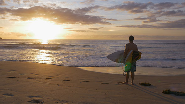 Surfer Gazing at the Beach Sunrise