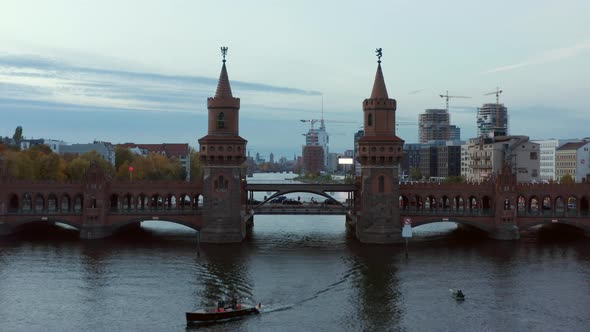 Aerial Establishing Shot of Through 2 Towers of Oberbaum Bridge in Berlin, Germany Revealing Skyline
