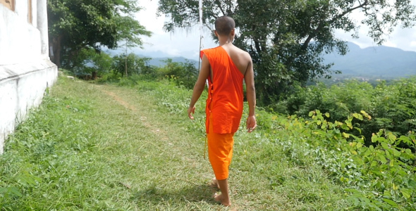 Monk Walking On Small Trail