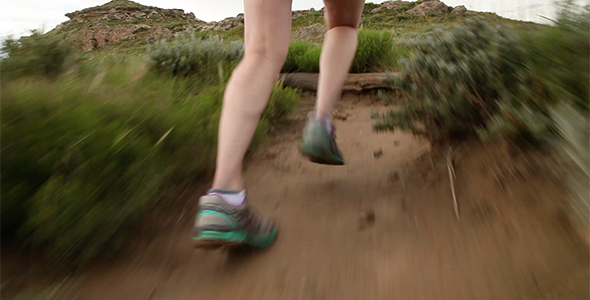 Woman Trail Running on High Desert Path