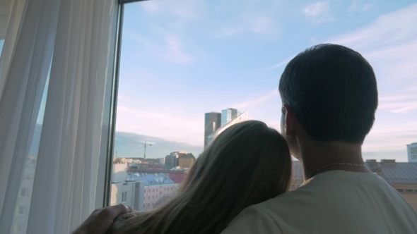 Young Couple Looking At Big City