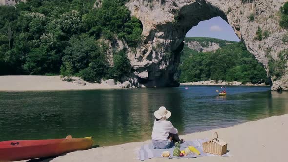 Couple on the Beach By the River in the Ardeche France Pont d Arc Ardeche Franceview of Narural Arch