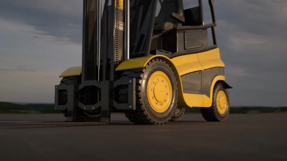 Professional forklift is using hydraulic machinery to load heavy cargo.