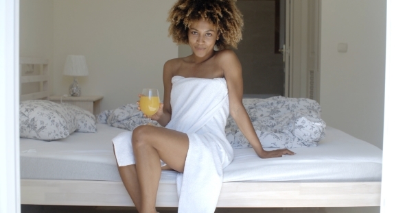 Relaxed Woman Drinking Orange Juice