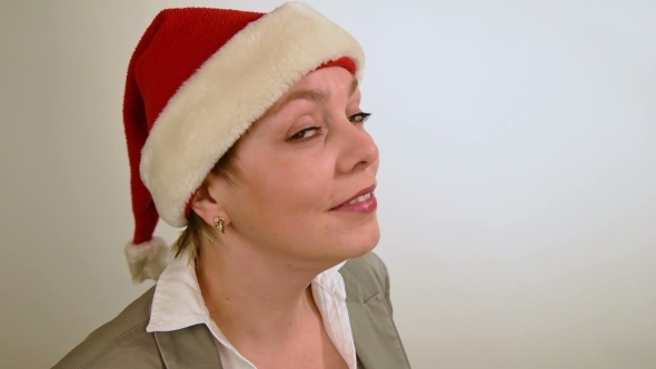 Pretty Girl In Red Christmas Santa Hat Smiles