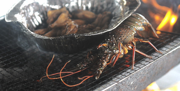 Lobster Cooking On Grill Fire