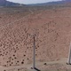 4K Drone circles windmill spinning in high desert of california - VideoHive Item for Sale