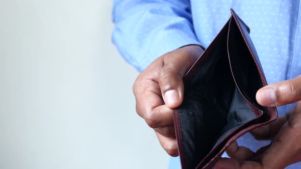 Man Hand Open an Empty Wallet with Copy Space.