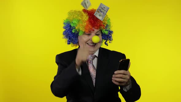 Clown Businesswoman Freelancer Receives Money Income While Using Mobile Phone