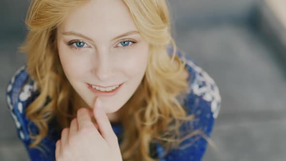 Blue Eyes of a Young Woman Looking Into the Camera