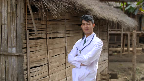 Asian Rural Doctor Posing At Countryside