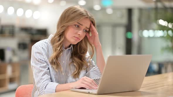 Loss, Businesswoman Reacting To Failure on Laptop in Office 