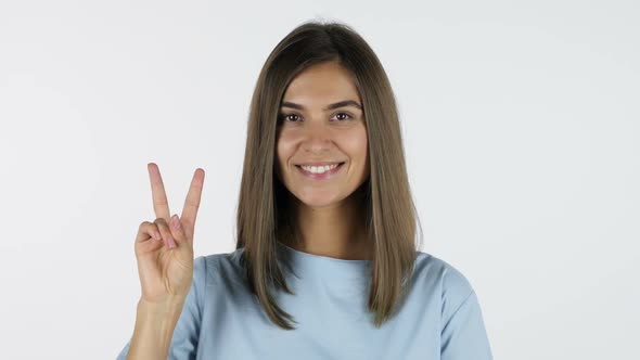 Win, Sign of Victory, Beautiful Girl, White Background in Studio