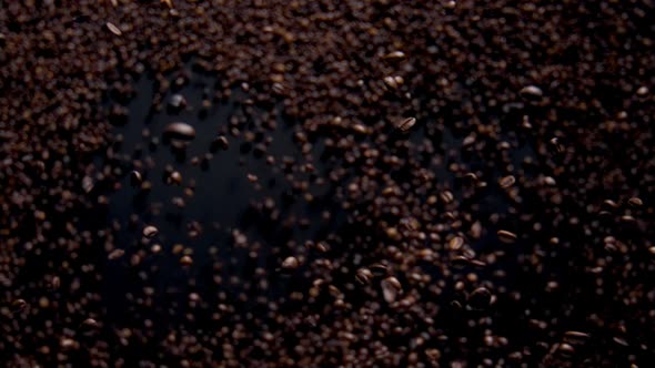 Magic Falling Coffee Grains on Dark Background