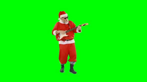 Santa claus singing a song and playing guitar