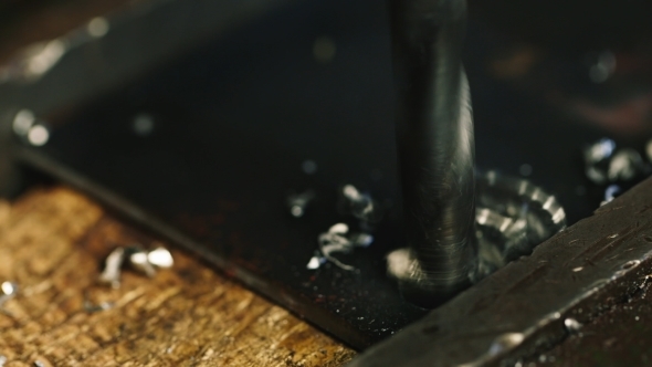 The Drill Drills Metal Part